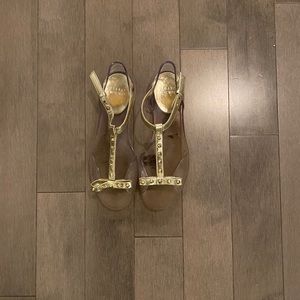 Stewart Weitzman gold and clear flat sandal